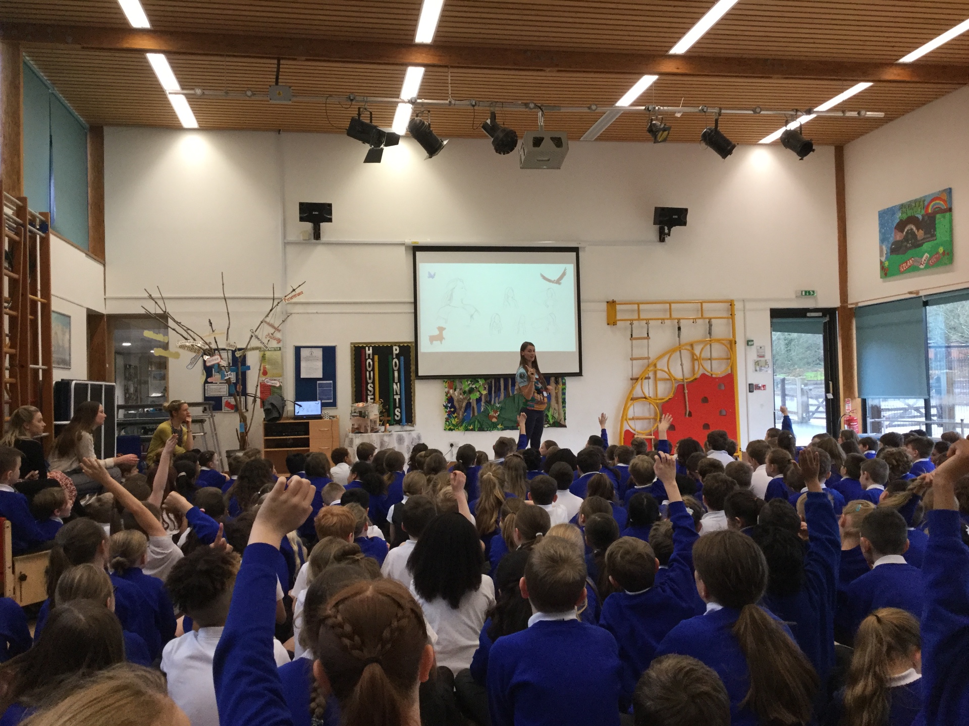 Laura speaking to a packed school assembly of children